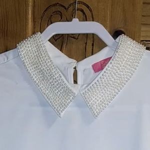 Elegant cream colored Catherine Malandrino blouse with pearl embellished collar.